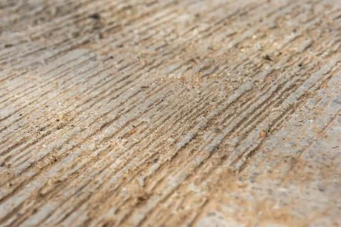 A rough concrete surface with linear grooves used to improve traction Stock Photos