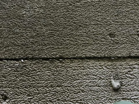Rough Concrete Surface Texture with Chevron Pattern Stock Photos