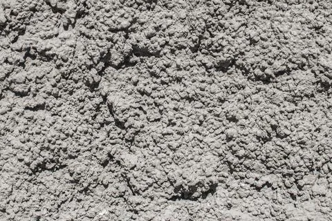Rough concrete texture with strong relief pattern Stock Photos