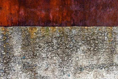 Rough concrete wall with rusted sheet metal above Stock Photos