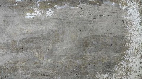 Rough concrete wall texture with visible cracks and dirt. Weathered surface.. Stock Photos