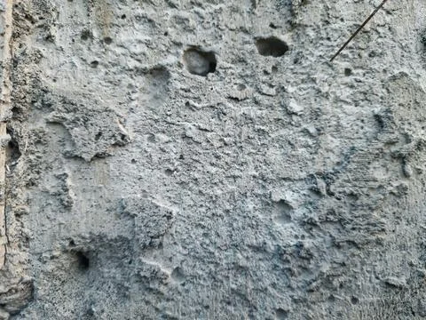 Rough concrete wall texture with weathered grey stone surface details Stock Photos
