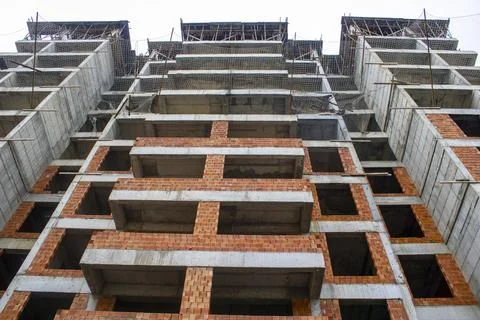 Rough construction is the process of building a structure from the ground up. Stock Photos