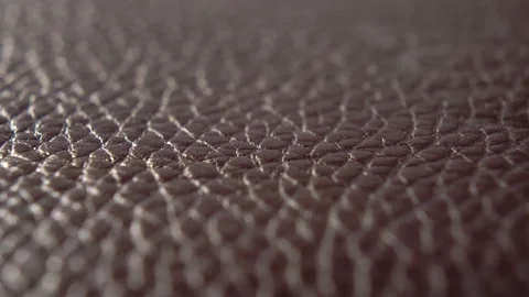 Rough cowhide covering close-up. Texture of brown shabby material. Macro Stock Footage 181865365