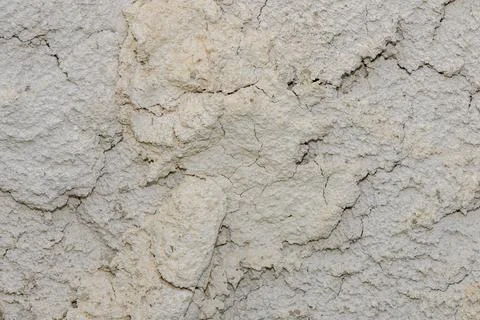 Rough, cracked light gray clay and dried earth texture Stock Photos