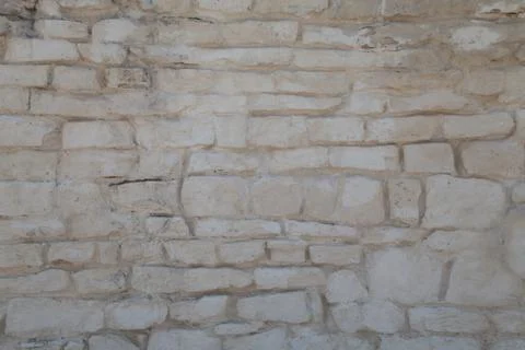 Rough cut stone wall seamless texture background Foto stock