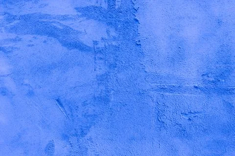 Rough dark blue plaster applied to the wall surface Stock Photos