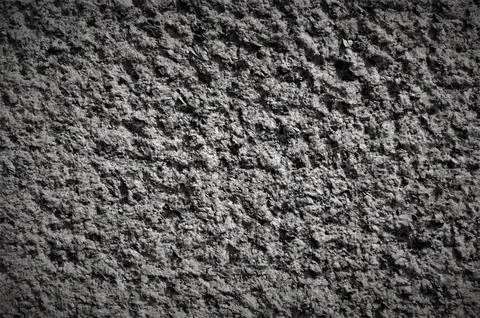 Rough dark gray stone background. Stock Photos