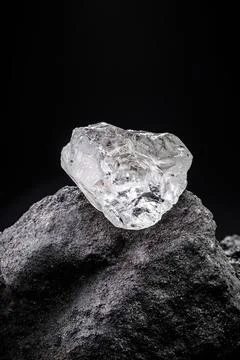Rough diamond, uncut gemstone, concept of luxury or wealth Stock Photos