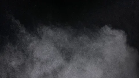 Rough dust cloud slowly settling down creating atmospheric effect 4K Vídeo Stock 76464600