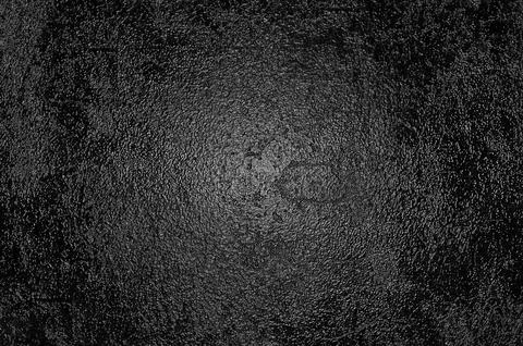 Rough embossed glossy black surface Stock Photos