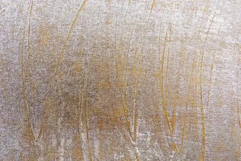 Rough golden painted surface background. Stock Photos