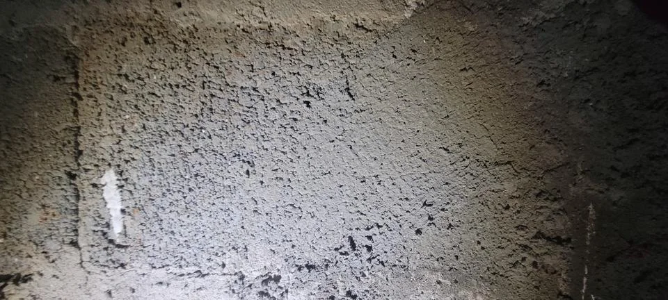 Rough gray cement wall with authentic plaster texture, exposed repairs and .. Stock Photos