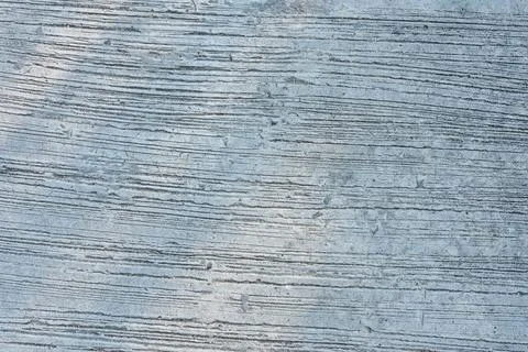 Rough gray concrete surface with horizontal lines and textured patterns Stock Photos