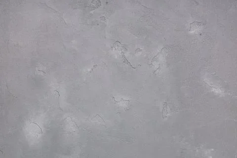 Rough gray concrete wall texture background with imperfections and subtle col Stock Photos