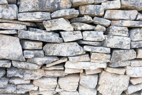 Rough Gray Stone Wall With Irregular Rocks For Rustic Masonry And Exterior Stock Photos