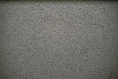 Rough Gray Textured Wall Surface with Decorative Plaster Finish 스톡 사진
