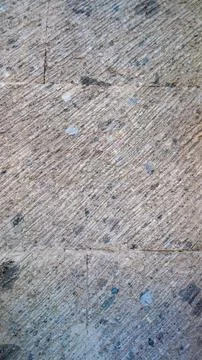 Rough gray volcanic stone wall with diagonal chiseled grooves texture Photos