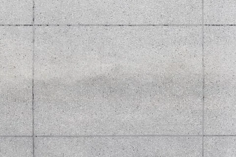 Rough gray wall made of concrete plates, background texture Stock Photos