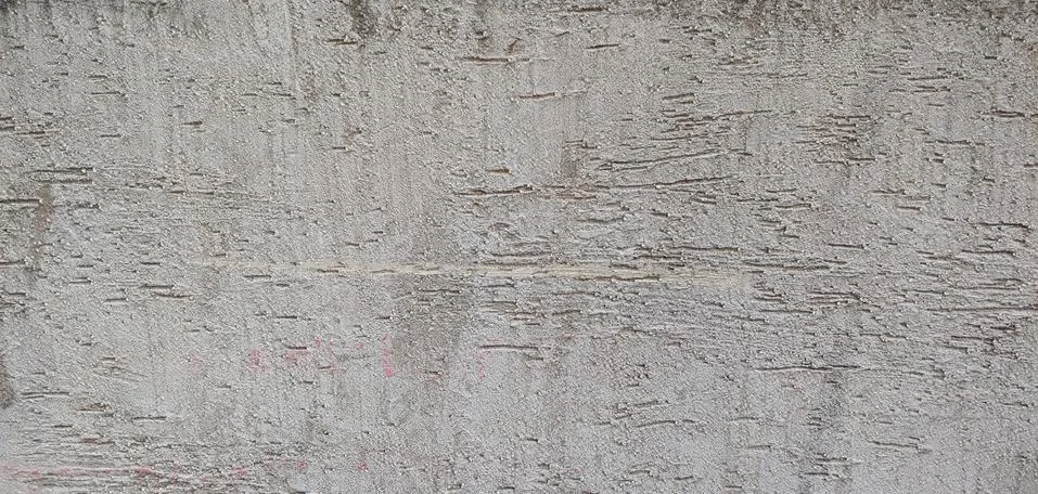 Rough gray wall with roller marks background Stock Photos