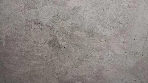 Rough grey concrete wall surface with natural weathered stone texture details Photos