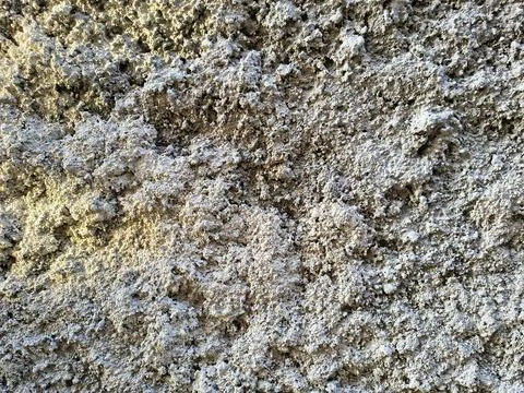 Rough grey concrete wall texture macro background with heavy bumps Stock Photos