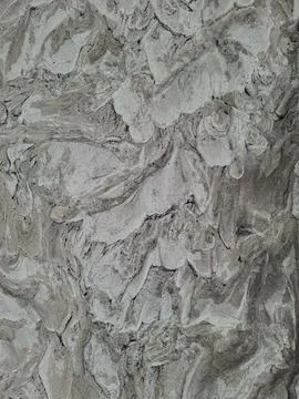 Rough grey plaster stucco texture with swirl patterns and uneven vintage wa.. Stock Photos