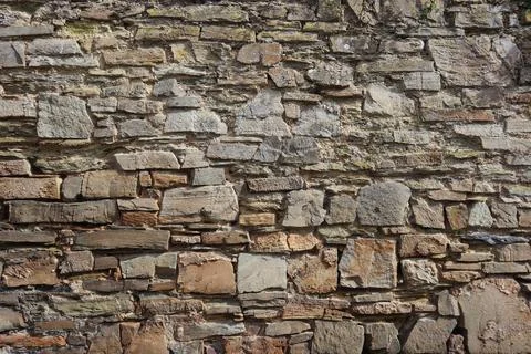 Rough grey stone wall background texture Foto stock