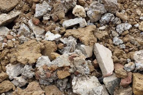 Rough heap of broken concrete, bricks and paving slabs Stock Photos
