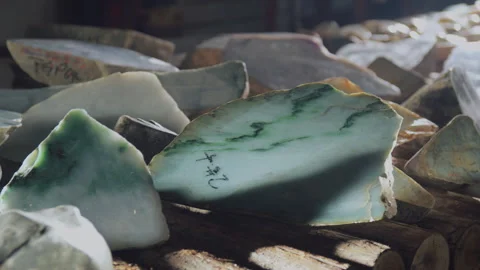 Rough jade displayed and sold in a jade jewelry store, Tianjin, China Stock Footage 140762471
