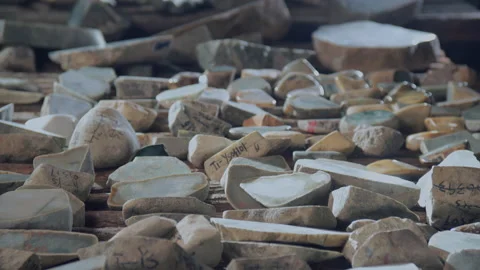 Rough jade displayed and sold in a jade jewelry store, Tianjin, China Stock Footage 140762677