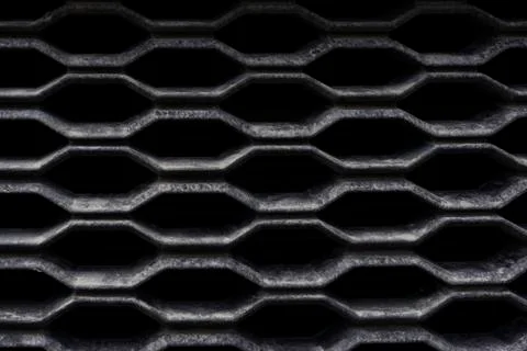 Rough lattice backdrop with cells of complex shape of black color with dirt 스톡 사진