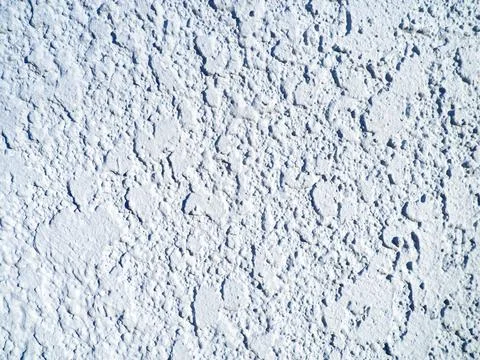 Rough light surface. Background from a stone wall. Cement stains.  White ba.. Stock Photos