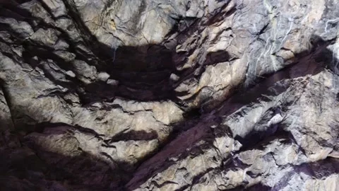 Rough Limestone Tunnel Wall Texture with Natural Erosion Patterns Stock Footage 336475939