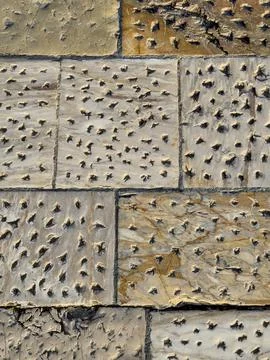 Rough Limestone Wall Showcasing Erosion Marks And Rustic Charm Stock Photos