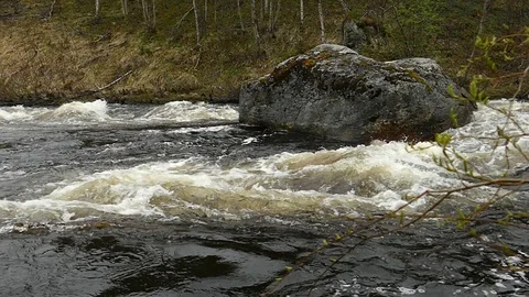 Rough mountain river in early spring, slow motion footage. Stock Footage 102748390
