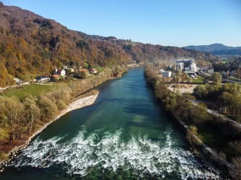 Rough mountain river with rapids and autumn forest Stock Photos
