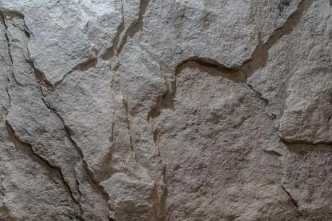 Rough natural stone wall texture background with realistic rock surface Stock Photos