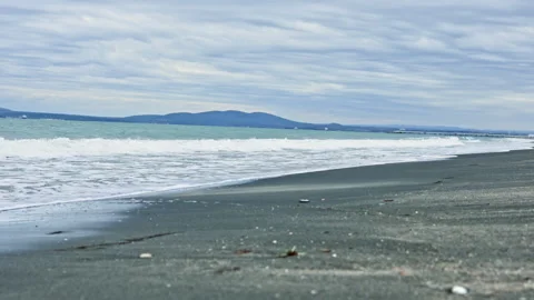 Rough ocean scene. Stormy coast with crashing waves. Overcast beach with foamy Stock Footage 340176296