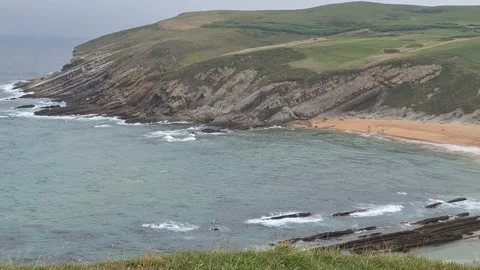 Rough Ocean Waves on a Beach with Coastal Cliffs in Western Spain Stock-Footage 343255440