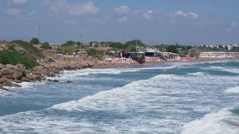 Rough ocean waves break on seaside resort beach Stock Footage 95269706