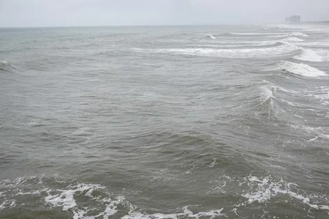 Rough ocean waves on a cloudy stormy day Stock Photos