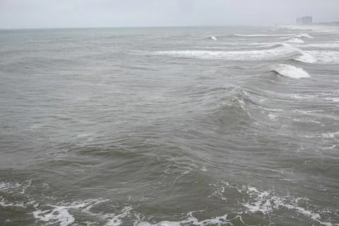 Rough ocean waves on a cloudy stormy day Stock Photos