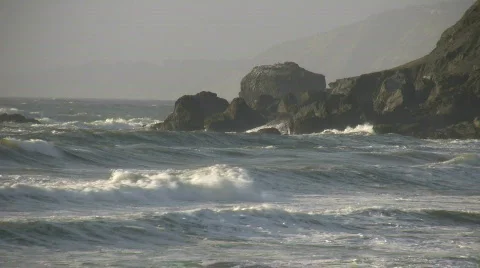 Rough ocean waves crash against the rocky San Francisco shoreline Stock-Footage 360348