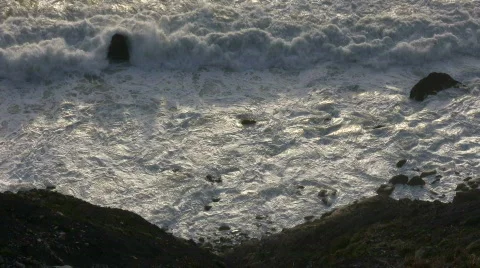 Rough ocean waves crash against the rocky San Francisco shoreline Stock Footage 360353