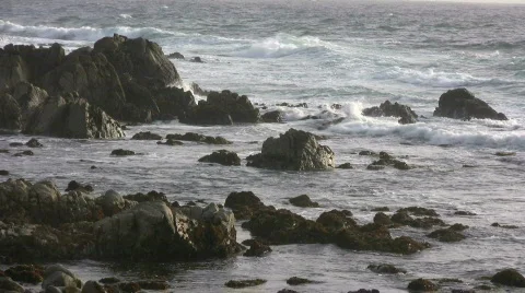 Rough ocean waves crash against the rocky California shoreline Stock Footage 360390