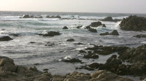 Rough ocean waves crash against the rocky California shoreline Stock Footage 360391