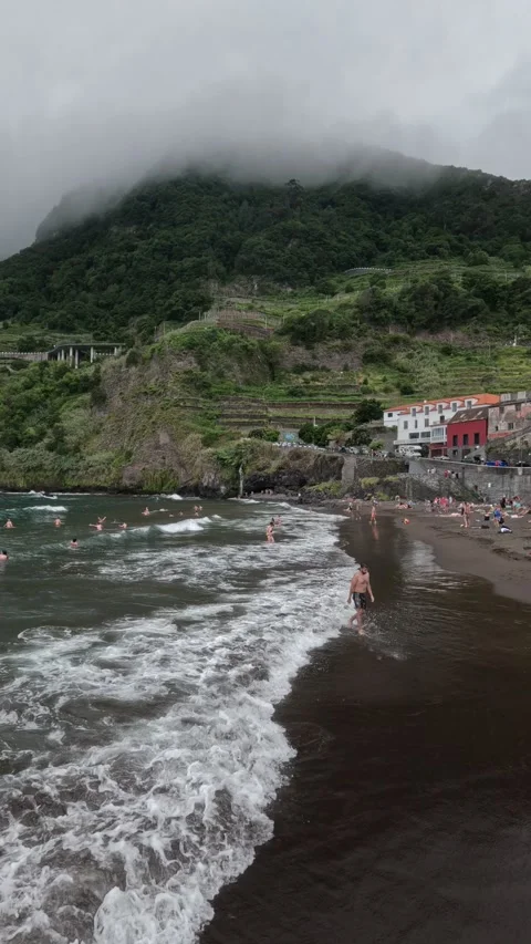 Rough Ocean Waves Crashing on Volcanic Beach in Seixal, Madeira Stock Footage 311203741