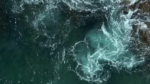 Rough ocean waves splashing against rocky shore. Video stock 308608898