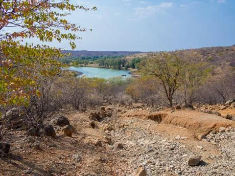 Rough offroad track with large ruts along Kunene River between Kunene River Foto stock